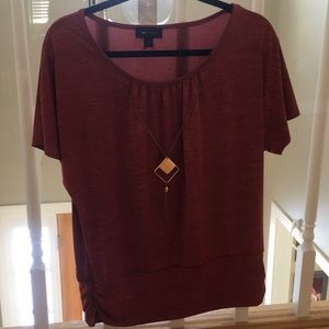 Textured red shirt with attached necklace